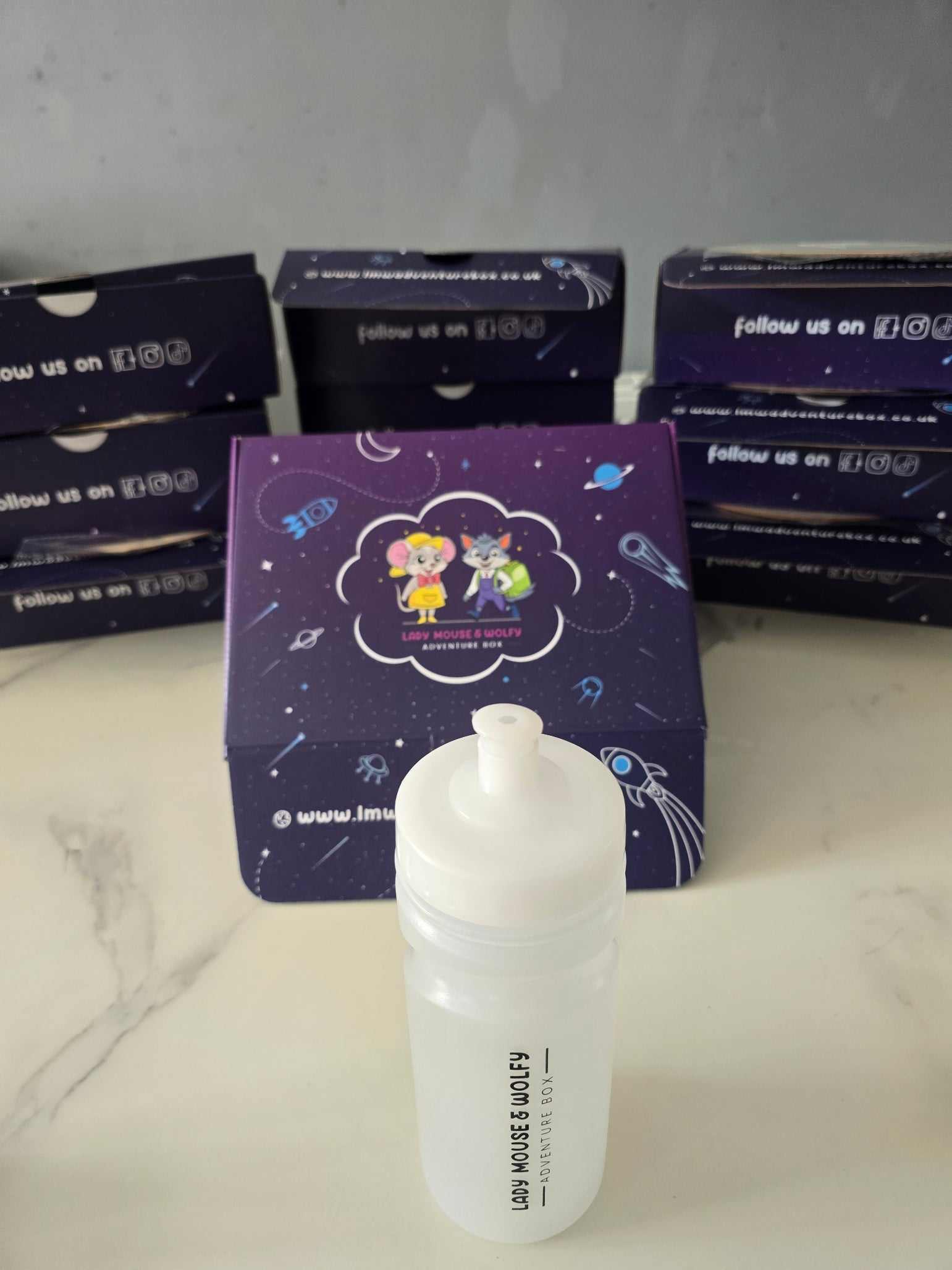 Branded water bottle with LMW Adventure Box packaging, ideal for school use.